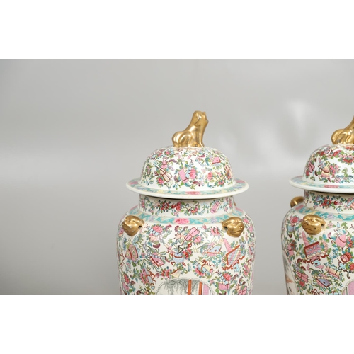 852 - PAIR OF LARGE LIDDED CHINESE 20THC VASES. A large pair of 20thc lidded vases, each painted with pane... 