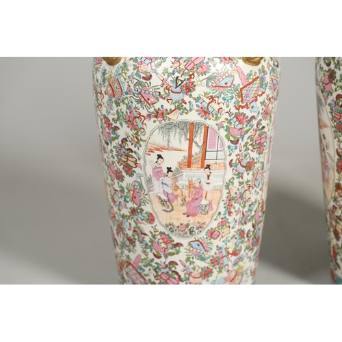 852 - PAIR OF LARGE LIDDED CHINESE 20THC VASES. A large pair of 20thc lidded vases, each painted with pane... 