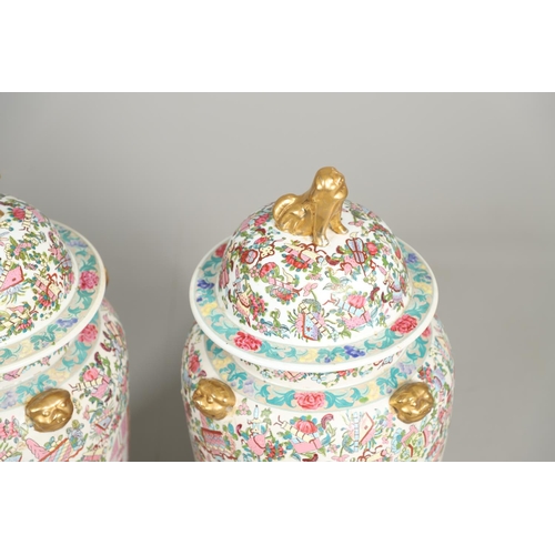 852 - PAIR OF LARGE LIDDED CHINESE 20THC VASES. A large pair of 20thc lidded vases, each painted with pane... 