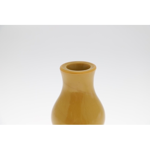 853 - A CHINESE BEIJING GLASS VASE. Probably 19thc, the double gourd shaped vase in an ochre colour. Unmar... 