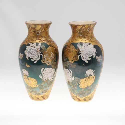 854 - PAIR OF LARGE JAPANESE SATSUMA VASES. Meiji period, each side painted with panels of flowers on a gr... 