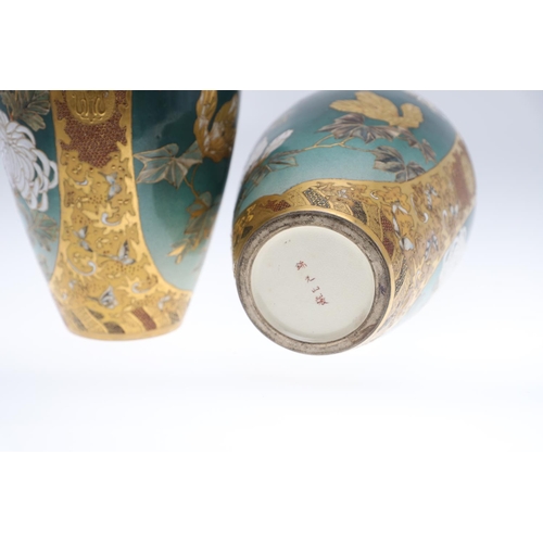 854 - PAIR OF LARGE JAPANESE SATSUMA VASES. Meiji period, each side painted with panels of flowers on a gr... 