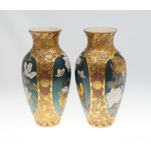 854 - PAIR OF LARGE JAPANESE SATSUMA VASES. Meiji period, each side painted with panels of flowers on a gr... 