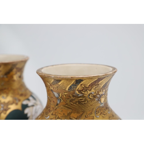 854 - PAIR OF LARGE JAPANESE SATSUMA VASES. Meiji period, each side painted with panels of flowers on a gr... 