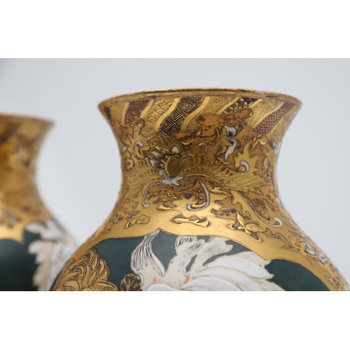 854 - PAIR OF LARGE JAPANESE SATSUMA VASES. Meiji period, each side painted with panels of flowers on a gr... 