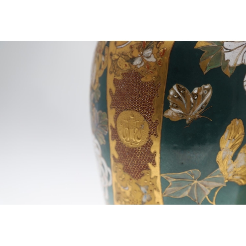 854 - PAIR OF LARGE JAPANESE SATSUMA VASES. Meiji period, each side painted with panels of flowers on a gr... 