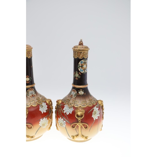 855 - LARGE PAIR OF LIDDED JAPANESE SATSUMA VASES. Meiji period, the large pair of bottle shaped vases wit... 