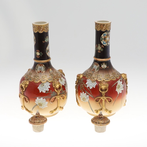 855 - LARGE PAIR OF LIDDED JAPANESE SATSUMA VASES. Meiji period, the large pair of bottle shaped vases wit... 