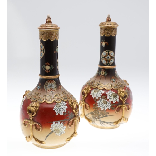 855 - LARGE PAIR OF LIDDED JAPANESE SATSUMA VASES. Meiji period, the large pair of bottle shaped vases wit... 