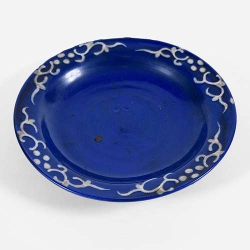 857 - UNUSUAL CHINESE WHITE SLIP BLUE GLAZED DISH. Probably 18thc or 19thc in the Ming style, the blue gla... 