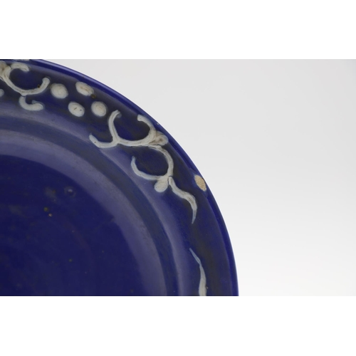 857 - UNUSUAL CHINESE WHITE SLIP BLUE GLAZED DISH. Probably 18thc or 19thc in the Ming style, the blue gla... 