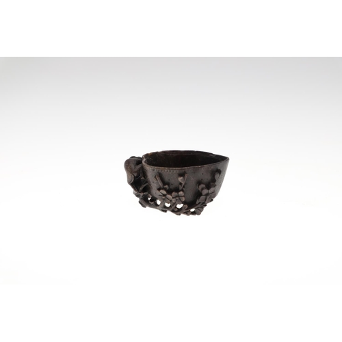 861 - CHINESE CARVED SOAPSTONE GROUP, & CARVED SAUCE BOAT. A white and black carved soapstone with a singl... 