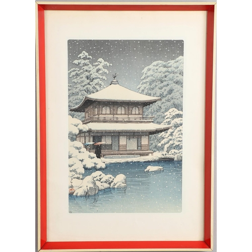 874 - JAPANESE WOODBLOCK PRINT - KAWASE HASUI (1883-1957). A coloured woodblock print of 'Evening Snowfall... 