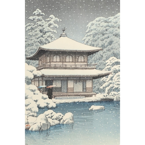 874 - JAPANESE WOODBLOCK PRINT - KAWASE HASUI (1883-1957). A coloured woodblock print of 'Evening Snowfall... 