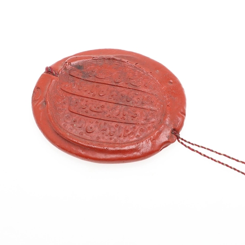 883 - EARLY WAX SEAL - ISLAMIC SCRIPT. An interesting oval shaped wax seal, with four lines of Islamic scr... 