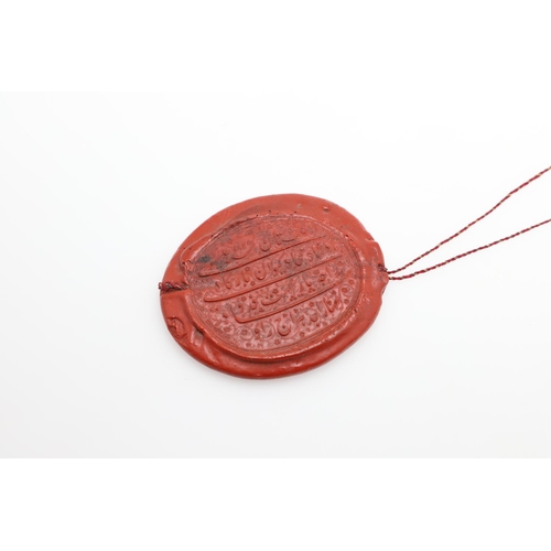 883 - EARLY WAX SEAL - ISLAMIC SCRIPT. An interesting oval shaped wax seal, with four lines of Islamic scr... 