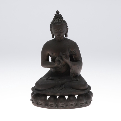 885 - LARGE BRONZE BUDDHA. Possibly Tibetan, the figure seated in meditation and with shou style symbols. ... 