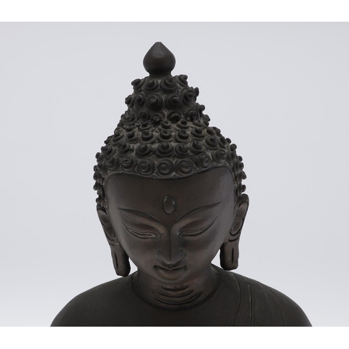 885 - LARGE BRONZE BUDDHA. Possibly Tibetan, the figure seated in meditation and with shou style symbols. ... 