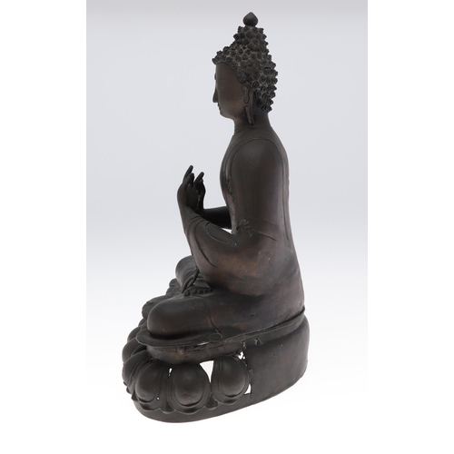 885 - LARGE BRONZE BUDDHA. Possibly Tibetan, the figure seated in meditation and with shou style symbols. ... 