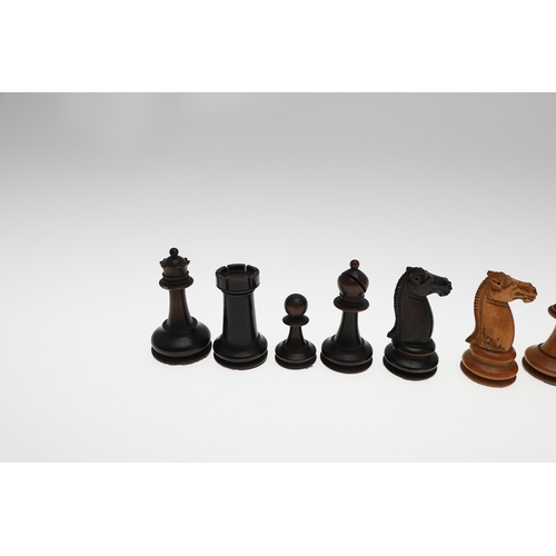 633A - ANTIQUE WOODEN CHESS SET. A boxwood and stained boxwood chess set, probably late 19thc/early 20thc a... 