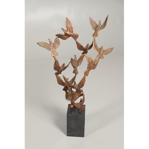 567 - JOHN BEHAN (B.1938). FLIGHT OF THE BIRDS. (d) Signed, light brown patina, on granite base
65cm; plus... 