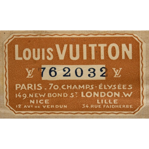 573 - VINTAGE LOUIS VUITTON SUITCASE. With a monogrammed exterior, leather trim with brass studs and brass... 