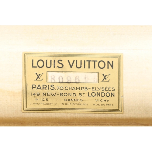 574 - VINTAGE LOUIS VUITTON SUITCASE. An early 20thc suitcase, with a monogrammed exterior, leather trim w... 