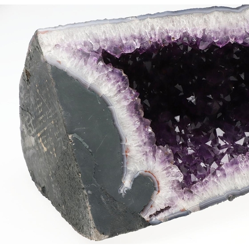 579 - GEOLOGICAL ROCK OR MINERAL SPECIMEN - AMETHYST GEODE. A large Amethyst geode, 50cms high, 23cms acro... 