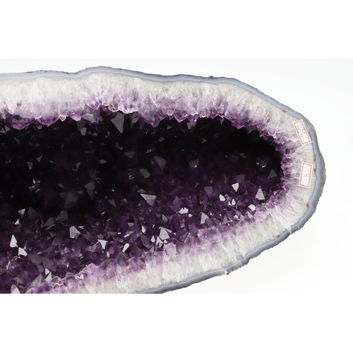 579 - GEOLOGICAL ROCK OR MINERAL SPECIMEN - AMETHYST GEODE. A large Amethyst geode, 50cms high, 23cms acro... 