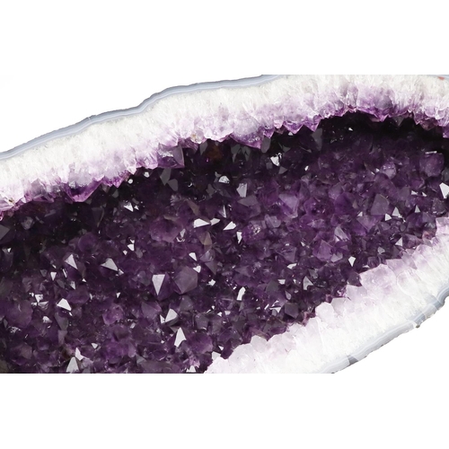 579 - GEOLOGICAL ROCK OR MINERAL SPECIMEN - AMETHYST GEODE. A large Amethyst geode, 50cms high, 23cms acro... 