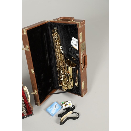 595 - CASED SAXOPHONE - TREVOR JAMES & CO, & ENGLISH CASED CLARINET. A brass 'The Horn' saxophone, Serial ... 