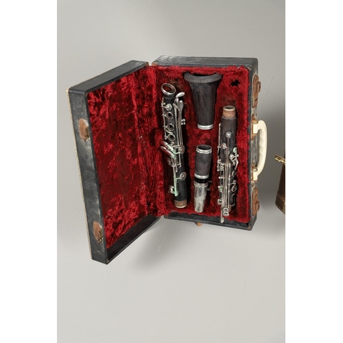 595 - CASED SAXOPHONE - TREVOR JAMES & CO, & ENGLISH CASED CLARINET. A brass 'The Horn' saxophone, Serial ... 