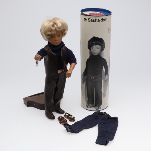 618 - VINTAGE BOXED SASHA DOLL - TRENDON LTD. The large doll with blond hair, and dressed in a leather wai... 