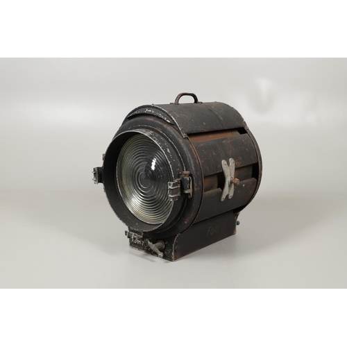 628 - MOLE-RICHARDSON & CO - LARGE THEATRE SPOTLIGHT. A large theatre spotlight, with a metal case and car... 