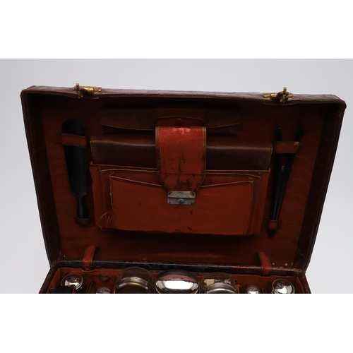 635 - FITTED CROCODILE SKIN SUITCASE - F H HAUPT, HAMBURG. A Crocodile skin suitcase with brass locks, sta... 