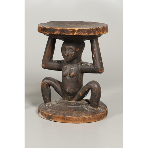 640 - CAMEROON TRIBAL POUNDING BOWL & LUBA-HEMBA TRIBAL STOOL. A carved tribal pounding bowl, the figure w... 