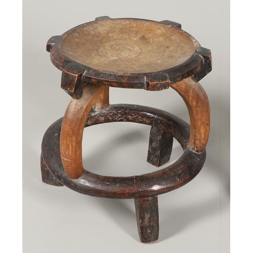 641 - TWO ANTIQUE CARVED TRIBAL STOOLS. Including a large Chief's hardwood stool with dish shaped seat, wi... 