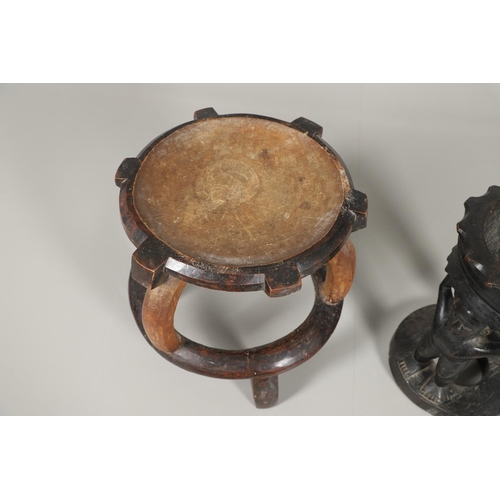 641 - TWO ANTIQUE CARVED TRIBAL STOOLS. Including a large Chief's hardwood stool with dish shaped seat, wi... 