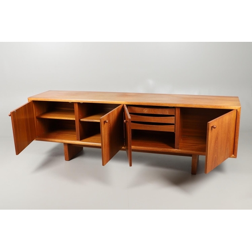 653 - MCINTOSH 'MC' MID CENTURY DINING SUITE 1973. Comprising a large teak sideboard with two large cupboa... 