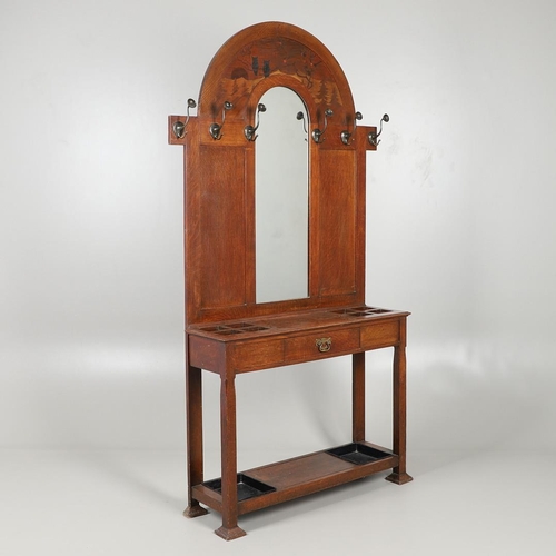 657 - LARGE ARTS AND CRAFTS OAK HALLSTAND. The large oak hallstand with an arched top, with a Rowley galle... 