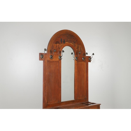 657 - LARGE ARTS AND CRAFTS OAK HALLSTAND. The large oak hallstand with an arched top, with a Rowley galle... 