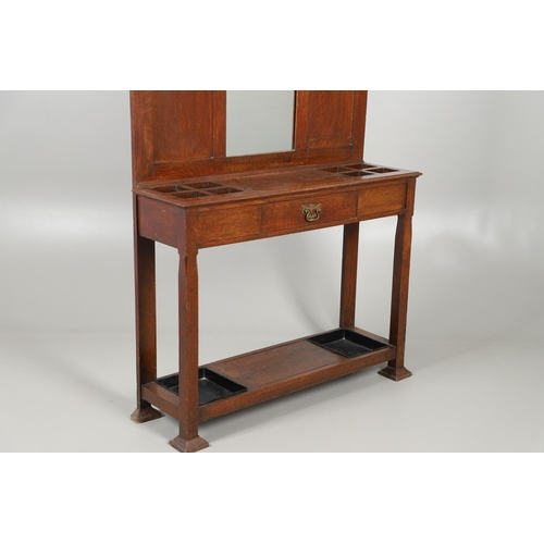 657 - LARGE ARTS AND CRAFTS OAK HALLSTAND. The large oak hallstand with an arched top, with a Rowley galle... 