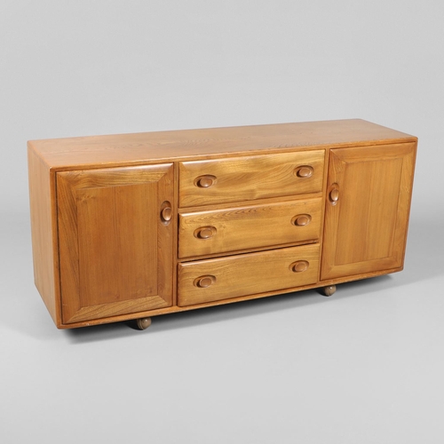 661 - LARGE ERCOL VINTAGE SIDEBOARD. A large elm sideboard with three central drawers including cutlery tr... 