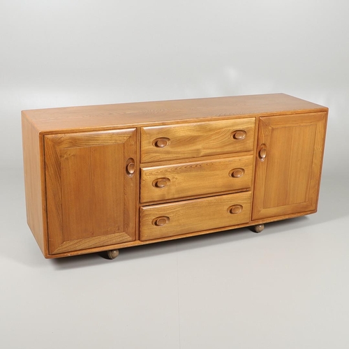 661 - LARGE ERCOL VINTAGE SIDEBOARD. A large elm sideboard with three central drawers including cutlery tr... 