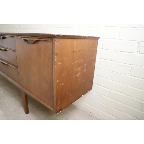 662 - G PLAN - RETRO TEAK SIDEBOARD. A teak sideboard with a large two door cupboard, three drawers (one f... 