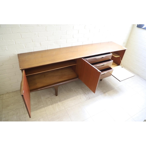 662 - G PLAN - RETRO TEAK SIDEBOARD. A teak sideboard with a large two door cupboard, three drawers (one f... 