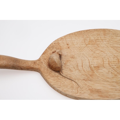 665 - ROBERT THOMPSON OF KILBURN CHEESE BOARD & TWO SMALL DISHES. An oval cheese board with curved handle ... 