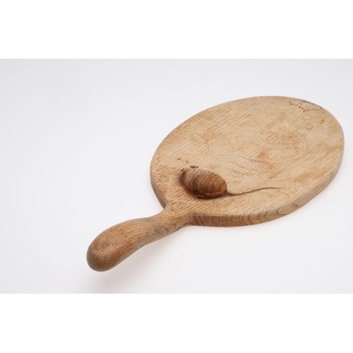 665 - ROBERT THOMPSON OF KILBURN CHEESE BOARD & TWO SMALL DISHES. An oval cheese board with curved handle ... 