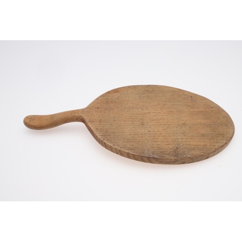 665 - ROBERT THOMPSON OF KILBURN CHEESE BOARD & TWO SMALL DISHES. An oval cheese board with curved handle ... 