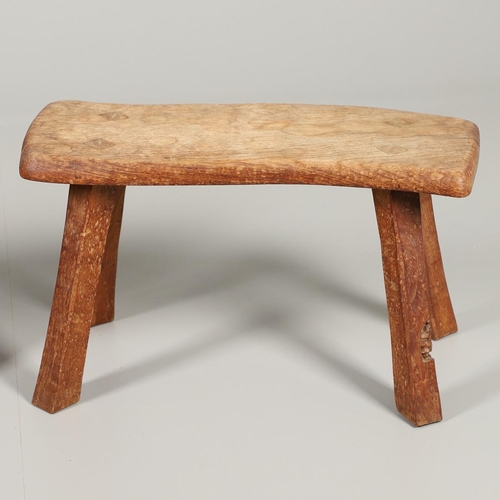 667 - THOMAS WHITTAKER 'GNOMEMAN' STOOL & ALAN GRAINGER 'ACORN MAN' STOOL. A Gnomeman oak stool with a cur... 